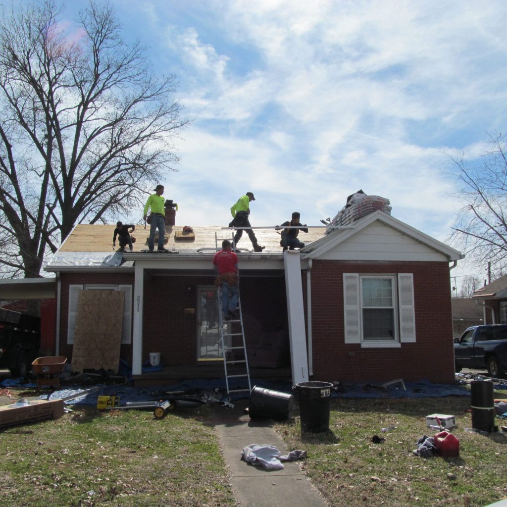 Installing roofing underlayment front of house pic 2
